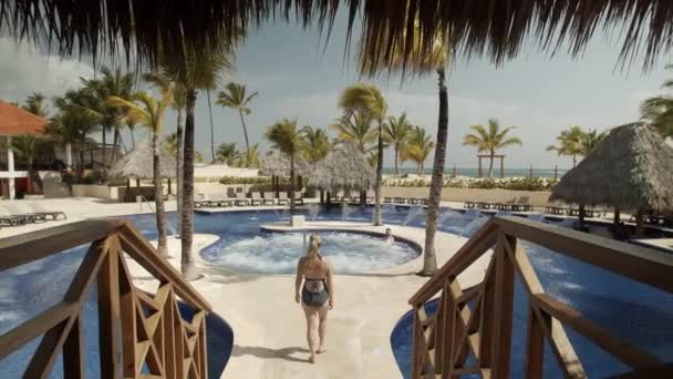 Woman Walks Resort Hot Tub Tropical Beach Pool — Stock Video