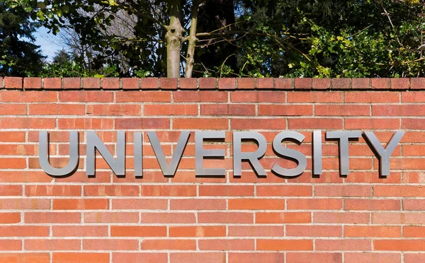 University Sign Brick Wall