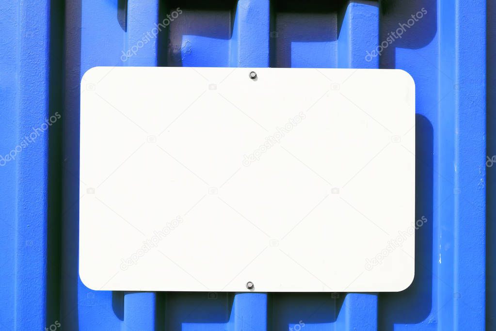 Metal Blank Sign on a Blue Container