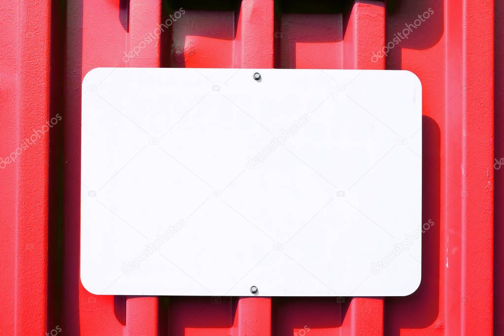 Metal Blank Sign on a Red Container