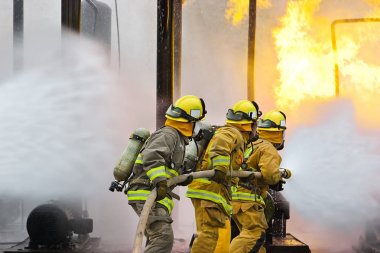 Three Firefighters Progress  clipart