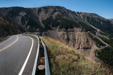 All American Road:  The Beartooth Highway crossing between Wyoming and Montana has been designated as both an All American Road and a National Scenic Byway.