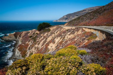 California Route 1:  Californias coastal highway curves along the side of a steep cliff in the Big Sur area south of Monterey.