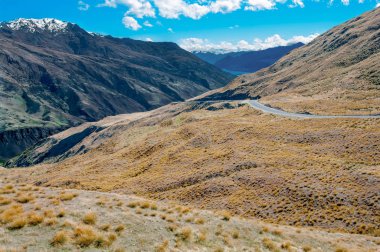 New Zealand Mountain Road:  An inland road passes through arid mountain terrain north of Queenstown on New Zealands South Island.