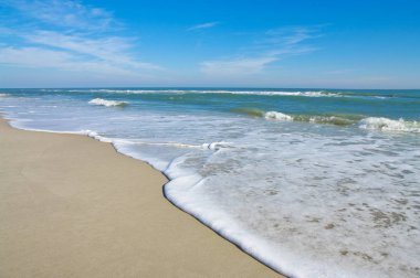 Sea Shore: Gentle waves reach the sand at Assateague Island National Seashore.