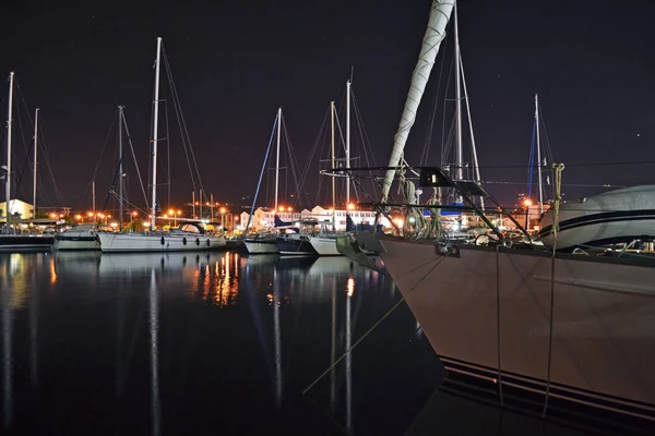 Sailing boats in Lefkada\'s port during the night.