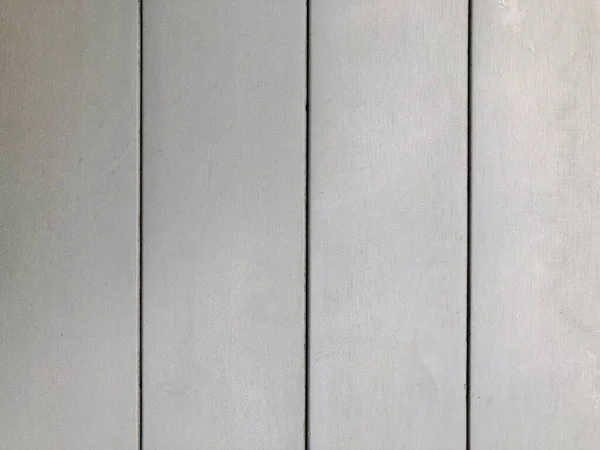 The surface of a gray wooden table. Wall texture background