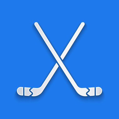 Kağıt kesiği buz hokeyi sopaları ikonu mavi arka planda izole edilmiş. Kağıt sanatı tarzı. Vektör İllüstrasyonu