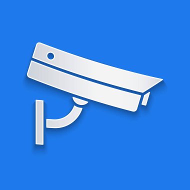 Kağıt kesiği, mavi arkaplanda izole edilmiş güvenlik kamerası simgesi. Kağıt sanatı tarzı. Vektör İllüstrasyonu