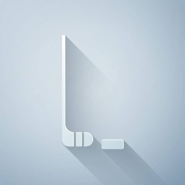 Kağıt kesiği, buz hokeyi sopası ve disk ikonu gri arka planda izole edilmiş. Kağıt sanatı tarzı. Vektör İllüstrasyonu