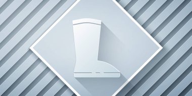 Kağıt kesiği, gri arkaplanda su geçirmez lastik bot simgesi var. Yağmurlu hava, balıkçılık, bahçe işleri için çizme. Kağıt sanatı tarzı. Vektör İllüstrasyonu