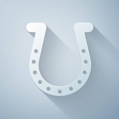 Kağıt kesiği at nalı simgesi gri arkaplanda izole edilmiş. Kağıt sanatı tarzı. Vektör İllüstrasyonu