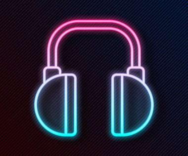 Parlayan neon hattı kulaklık simgesi siyah arkaplanda izole edildi. Kulaklıklar. Müzik, hizmet, iletişim ve operatör konsepti. Vektör İllüstrasyonu