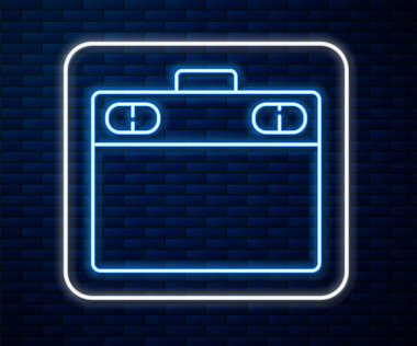 Parlayan neon hattı grafiksel tablet simgesi tuğla duvar arka planında izole edildi. Vektör İllüstrasyonu