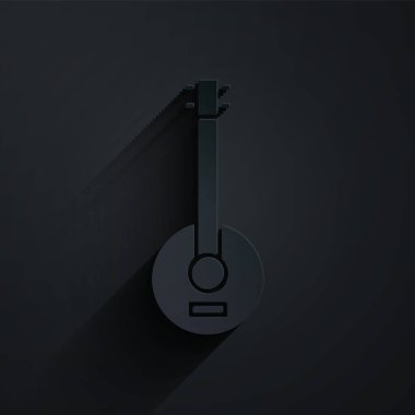 Kağıt kesiği Banjo simgesi siyah arkaplanda izole edildi. Müzik aleti. Kağıt sanatı tarzı. Vektör İllüstrasyonu