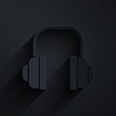 Kağıt kesiği kulaklık simgesi siyah arkaplanda izole edilmiş. Müşteri hizmetleri, yardım hattı, çağrı merkezi, faq, bakım. Kağıt sanatı tarzı. Vektör İllüstrasyonu