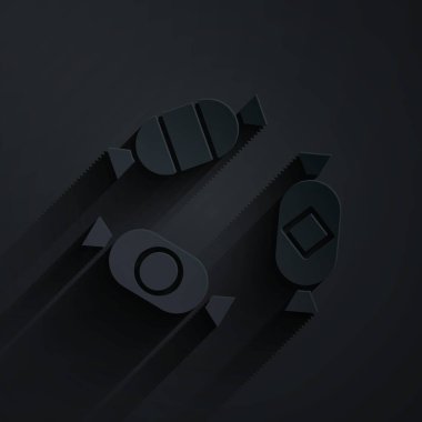 Kağıt kesiği Candy simgesi siyah arkaplanda izole edilmiş. Kağıt sanatı tarzı. Vektör İllüstrasyonu