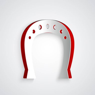 Kağıt kesiği at nalı simgesi gri arkaplanda izole edilmiş. Kağıt sanatı tarzı. Vektör İllüstrasyonu