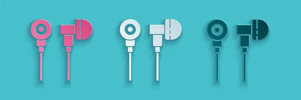 Paper cut Air headphones icon icon isolated on blue background. Holder wireless in case earphones garniture electronic gadget. Paper art style. Vector Illustration — Stock Vector