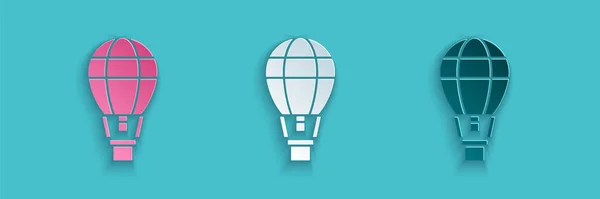 Paper cut Hot air balloon icon isolated on blue background. Air transport for travel. Paper art style. Vector Illustration