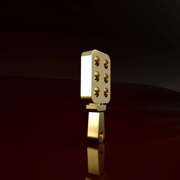 Ícone de remo de palmada de ouro isolado no fundo marrom. Um acessório fetichista. Brinquedo sexual para adultos. Conceito de minimalismo. 3D ilustração 3D render — Fotografia de Stock