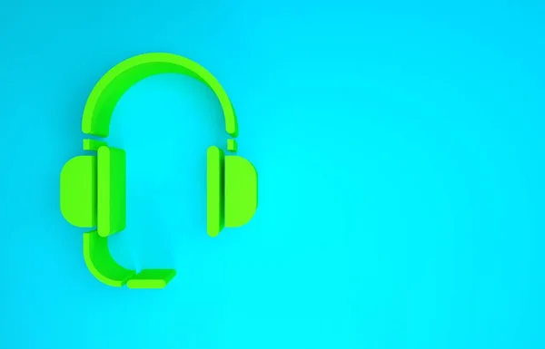 Grüne Kopfhörer mit Mikrofonsymbol isoliert auf blauem Hintergrund. Minimalismus-Konzept. 3D Illustration 3D Renderer — Stockfoto