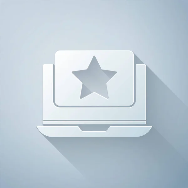Papier découpé ordinateur portable avec icône étoile isolé sur fond gris. Favori, meilleure note, symbole de récompense. Style art du papier. Illustration vectorielle — Image vectorielle