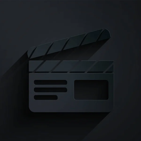 ペーパーカットムービークラッパーアイコンは黒の背景に隔離されています フィルムクラッパーボード クラッパーボードのサインだ 映画制作やメディア業界 紙のアートスタイル ベクターイラスト — ストックベクタ
