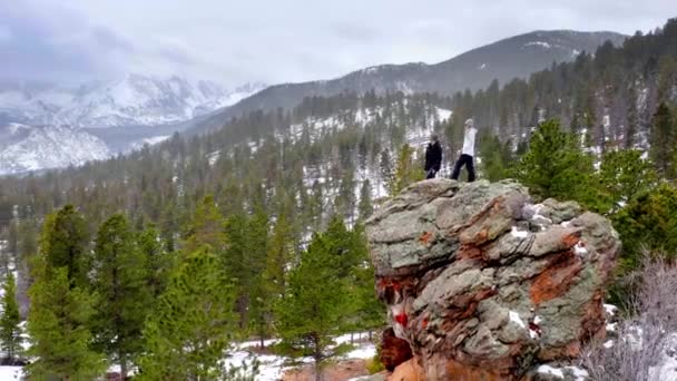 Hikers View Rocky Mountains Snow Colorado Aerial Drone — Stock Video