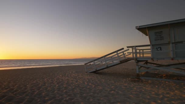Beach Lifeguard Shack Sunset Tracking Shot — Stock Video