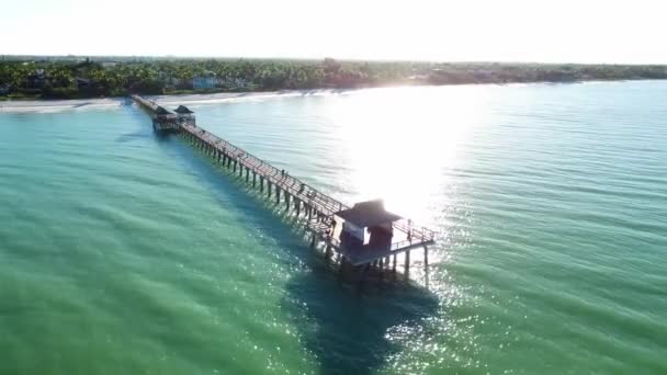 Small Pier Calm Ocean Sun Reflecting Water — Stock Video