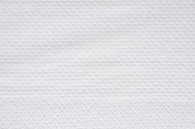 Beyaz mendil peçetesi, tuvalet hijyenik doku arka planı.