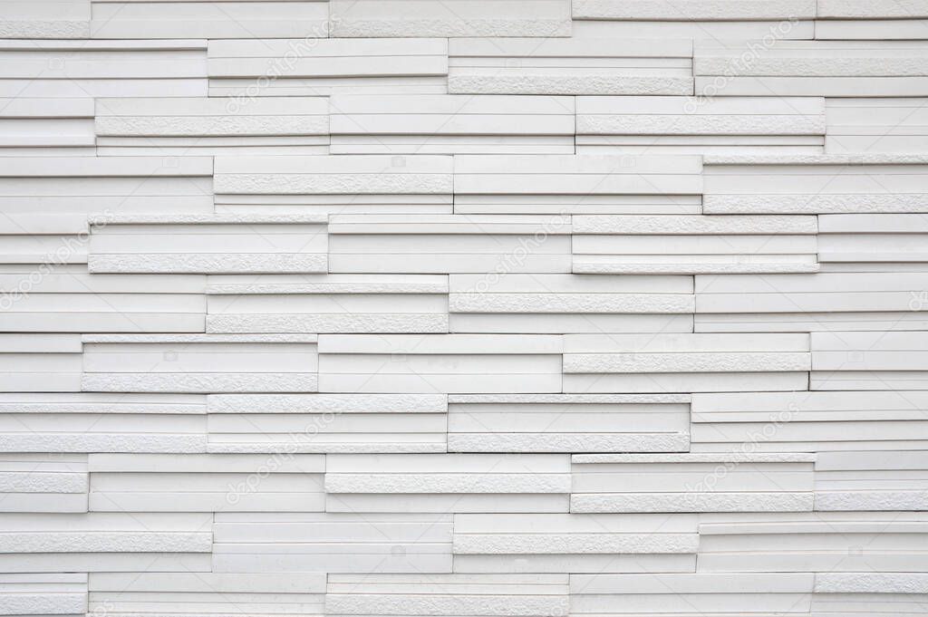 pattern of decorative white slate stone wall surface. Texture and background. Close up image
