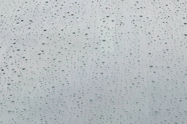 Drops of rain on car's glass , rain drops on clear window, select focus