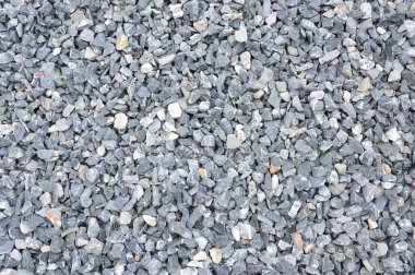 Gri ile karıştırılmış küçük bir küme. Ezilmiş kireçtaşı dokusu.