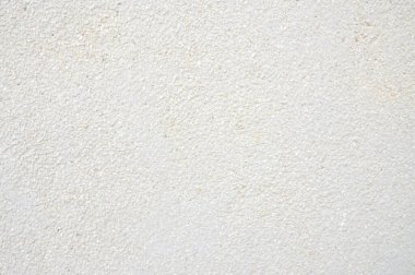 Beyaz duvar dokusu kum ve kaya karışımı yüzey zeminini yıkadı.