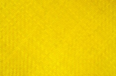 Geleneksel sarı el işi Tayland tarzı dokuma motifi mobilya malzemesi için arka plan hasır yüzeyi