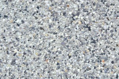 Kaya ve kum kümesi ve taş arkaplan dokusuyla tamamlanmış duvar.