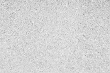 Yıkanmış kum dokusu ve arka plan. Duvar, çimento harcı ile karıştırılmış kum temizleme kabuğundan yapılmıştır. Taş duvar çiti arka planı.