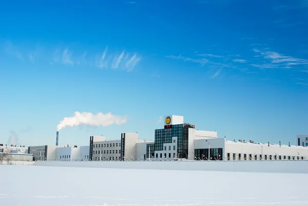 Building of modern plant in winter