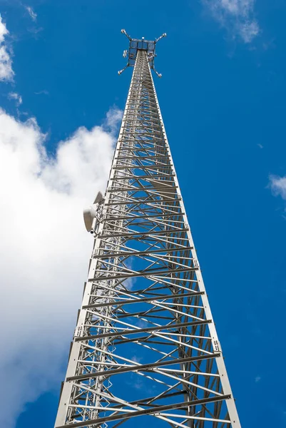 Aerial of cellular communication on the sky background