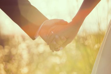 hands in shape of heart wedding