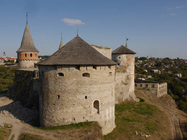 Medieval castle in the city of Kamyanets-Podilsky, Ukraine .  It is a formidable, strong fortress, whose walls are cut out of solid rock. The fortress stands at the top of a precipitous cliff . 