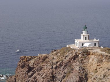 Akrotiri Lighthouse on the Greek island of Santorini clipart