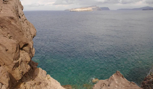 Panoramic views of the caldera, mountains, the Mediterranean Sea, and the city of Fira from the Akrotiri Lighthouse.