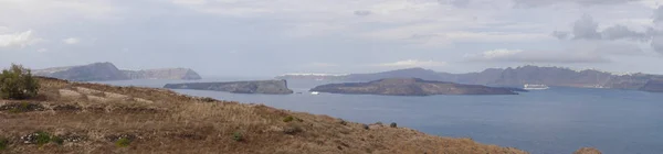 Panoramic views of the caldera, mountains, the Mediterranean Sea, and the city of Fira from the Akrotiri Lighthouse.