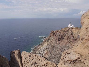 Views of the caldera, mountains, the Mediterranean Sea, and the city of Fira from the Akrotiri Lighthous, Santorini island Greece.