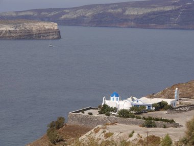 Views of the caldera, mountains, the Mediterranean Sea, and the city of Fira from the Akrotiri Lighthous, Santorini island Greece.