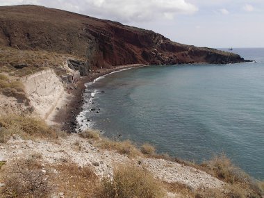 Red beach near the city of Akrotiri on Santorini island, Greece.