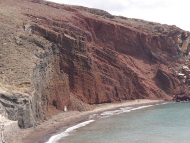Red beach near the city of Akrotiri on Santorini island, Greece.